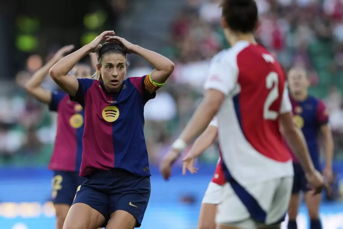 Barcelona's Alexia Putellas gestures during the women's Champions League final soccer match between Arsenal and FC Barcelona at the Jose Alvalade stadium in Lisbon, Saturday, May 24, 2025. (AP Photo/Armando Franca)