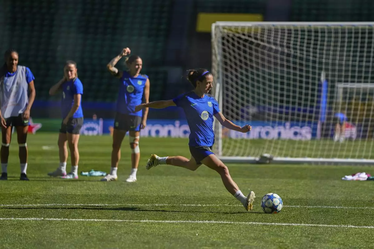 Barcelona's Aitana Bonmati plays the ball during a training session, on the eve of the women's Champions League final soccer match between Arsenal and FC Barcelona, at the Jose Alvalade Stadium, in Lisbon, Friday, May 23, 2025. (AP Photo/Armando Franca)