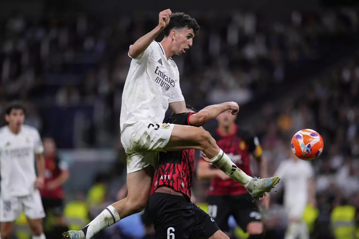 Real Madrid's Jacobo Ramon scores his side's second goal during a Spanish La Liga soccer match between Real Madrid and Mallorca in Madrid, Spain, Wednesday, May 14, 2025. (AP Photo/Manu Fernandez)