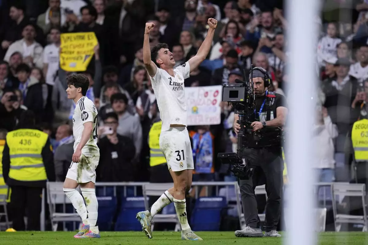 Real Madrid's Jacobo Ramon celebrates after scoring his side's second goal during a Spanish La Liga soccer match between Real Madrid and Mallorca in Madrid, Spain, Wednesday, May 14, 2025. (AP Photo/Manu Fernandez)