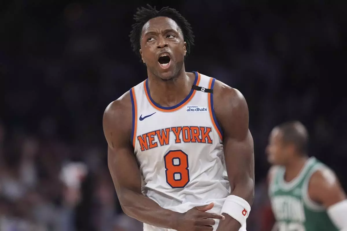 New York Knicks' OG Anunoby (8) celebrates after making a three-point shot during the second half of Game 6 in the Eastern Conference semifinals of the NBA basketball playoffs against the Boston Celtics Friday, May 16, 2025, in New York. (AP Photo/Frank Franklin II)