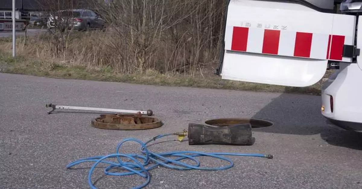 Danish people arrest 2 on suspicion of killing a man whose body was found in a sewer