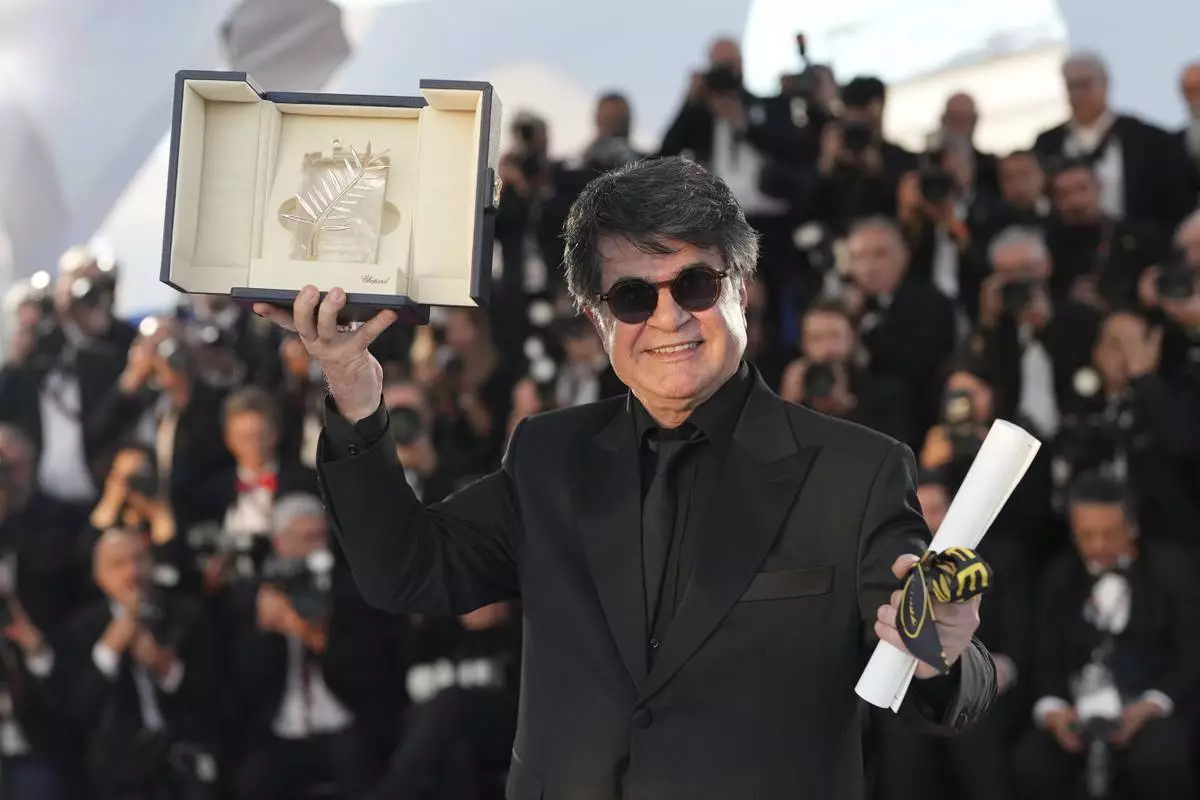 Director Jafar Panahi, winner of the Palme d'Or for the film 'It Was Just an Accident', poses for photographers at the awards ceremony photo call at the 78th international film festival, Cannes, southern France, Saturday, May 24, 2025. (AP Photo/Natacha Pisarenko)