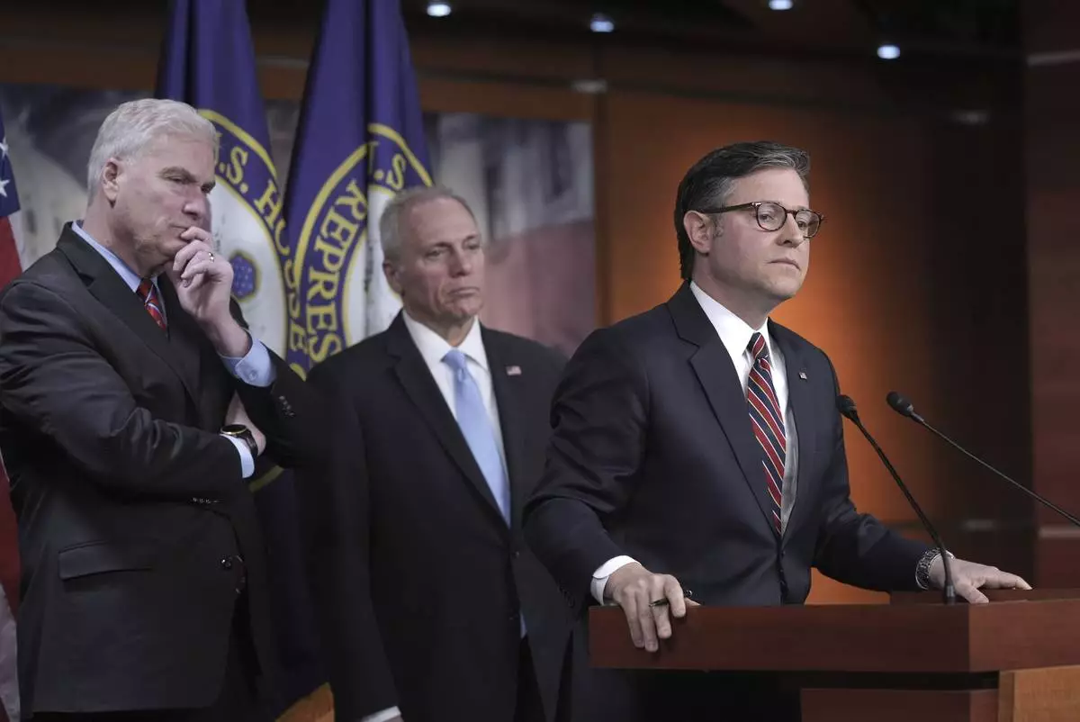 FILE - Speaker of the House Mike Johnson, R-La., joined from left by House Majority Whip Tom Emmer, R-Minn., and House Majority Leader Steve Scalise, R-La., talks to reporters about his push for a House-Senate compromise budget resolution to advance President Donald Trump's agenda, even with opposition from hard-line conservative Republicans, at the Capitol in Washington, April 8, 2025. (AP Photo/J. Scott Applewhite, File)