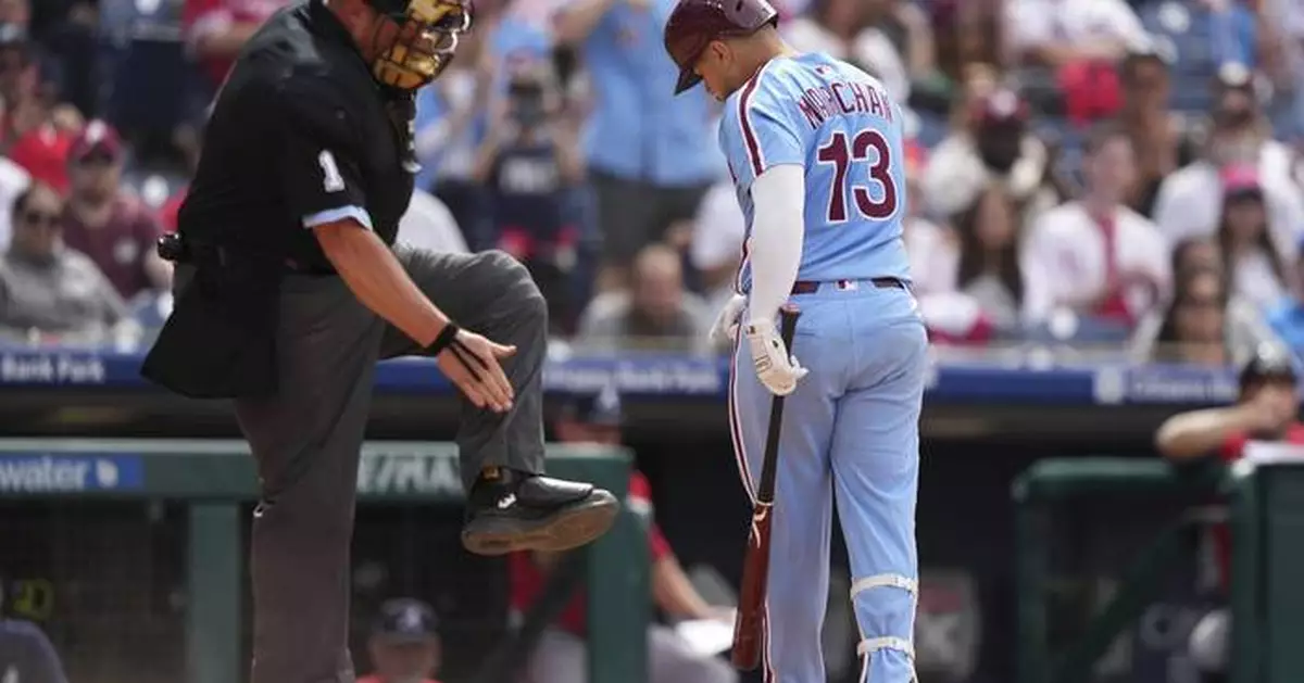 Marchán leads Harper-less Phillies over Braves 5-4 in doubleheader opener for 23rd win in 29 games