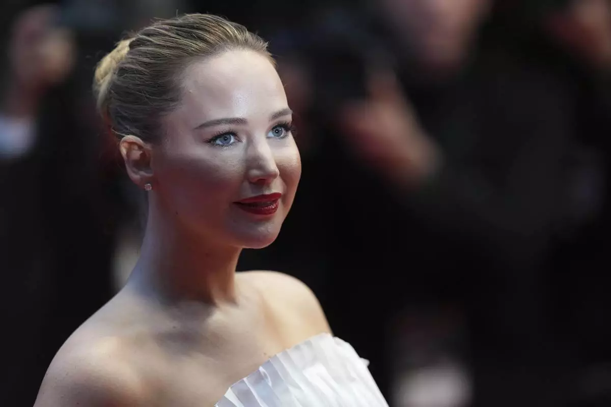 Jennifer Lawrence poses for photographers upon arrival at the premiere of the film 'Die, My Love' at the 78th international film festival, Cannes, southern France, Saturday, May 17, 2025. (Photo by Lewis Joly/Invision/AP)