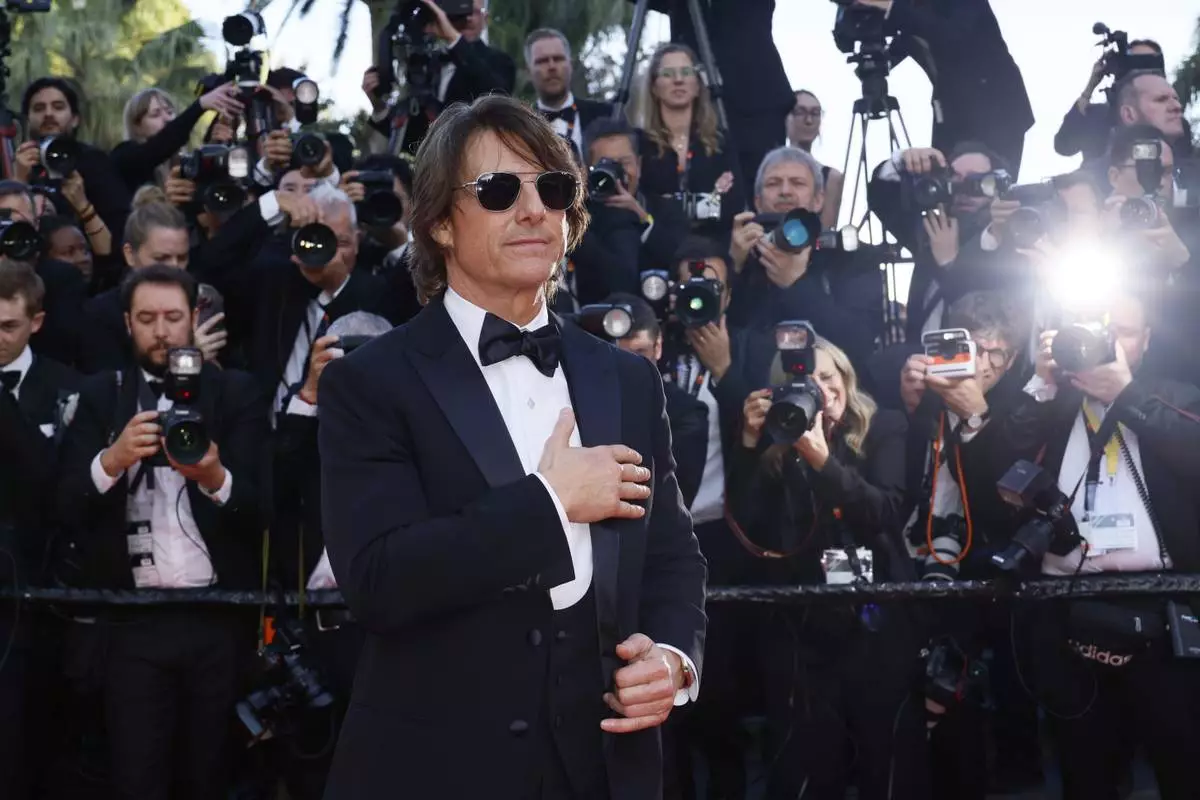 Tom Cruise poses for photographers upon arrival at the premiere of the film 'Mission: Impossible - The Final Reckoning' at the 78th international film festival, Cannes, southern France, Wednesday, May 14, 2025. (Photo by Joel C Ryan/Invision/AP)