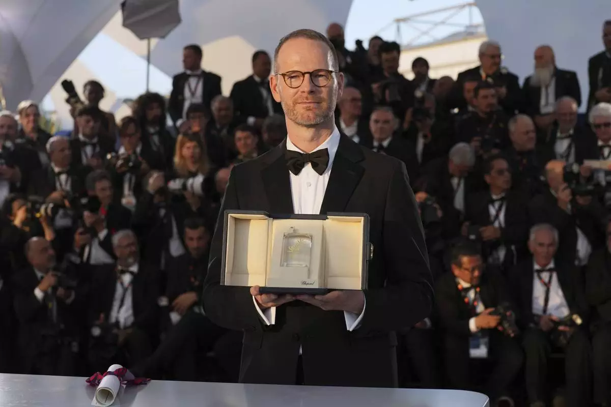 Director Joachim Trier, winner of the grand prix for the film 'Sentimental Value', poses for photographers at the awards ceremony photo call at the 78th international film festival, Cannes, southern France, Saturday, May 24, 2025. (AP Photo/Natacha Pisarenko)