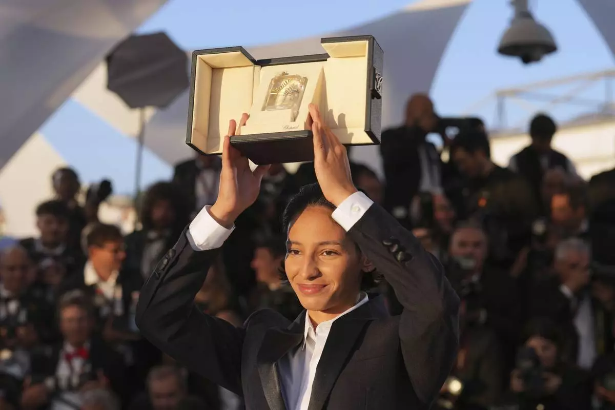 Nadia Melliti, winner of the award for best actress for the film 'The Little Sister', poses for photographers at the awards ceremony photo call at the 78th international film festival, Cannes, southern France, Saturday, May 24, 2025. (AP Photo/Natacha Pisarenko)