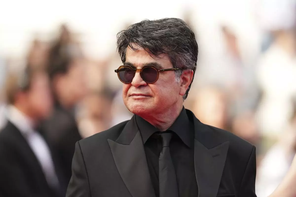 Jafar Panahi poses for photographers during the awards ceremony red carpet at the 78th international film festival, Cannes, southern France, Saturday, May 24, 2025. (Photo by Scott A Garfitt/Invision/AP)