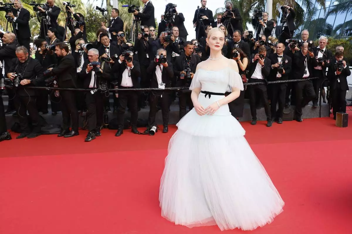 Elle Fanning poses for photographers during the awards ceremony red carpet at the 78th international film festival, Cannes, southern France, Saturday, May 24, 2025. (Photo by Joel C Ryan/Invision/AP)