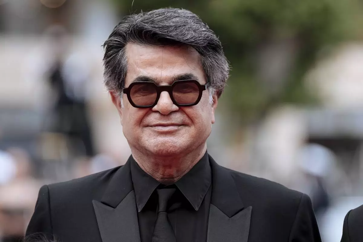 Director Jafar Panahi poses for photographers upon arrival at the premiere of the film 'It Was Just an Accident' at the 78th international film festival, Cannes, southern France, Tuesday, May 20, 2025. (Photo by Lewis Joly/Invision/AP)
