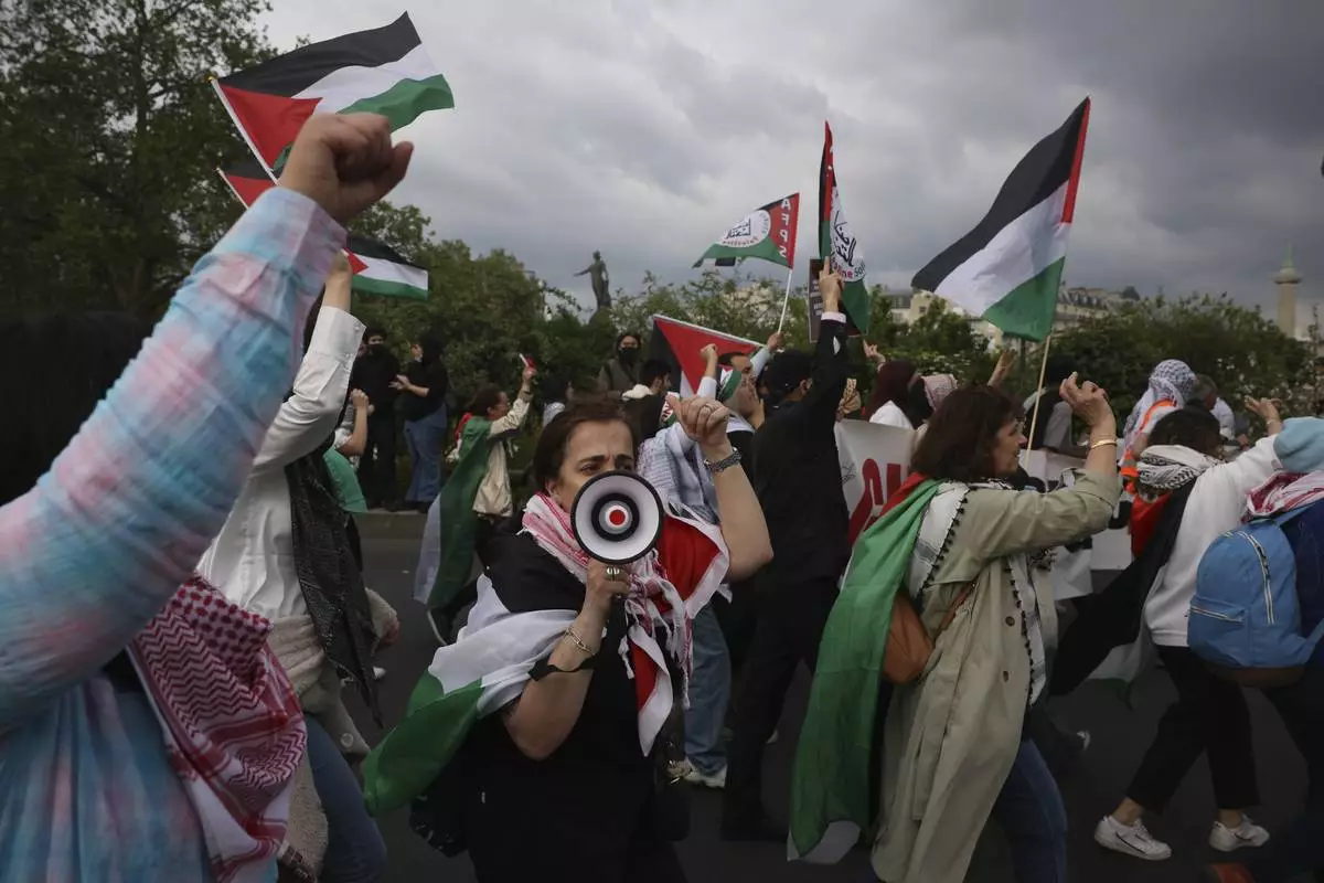 FILE - Protesters march during the May Day demonstration, Wednesday, May 1, 2024 in Paris. (AP Photo/Thomas Padilla, File)