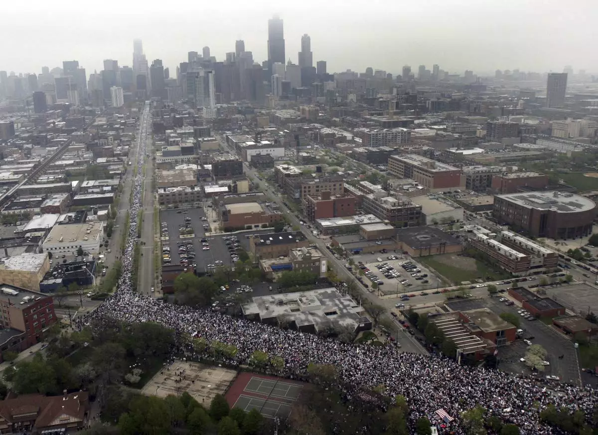 FILE - More than 300,000 demonstrators march to show support for immigrant rights in Chicago, May 1, 2006. (AP Photo/Jeff Roberson, File)