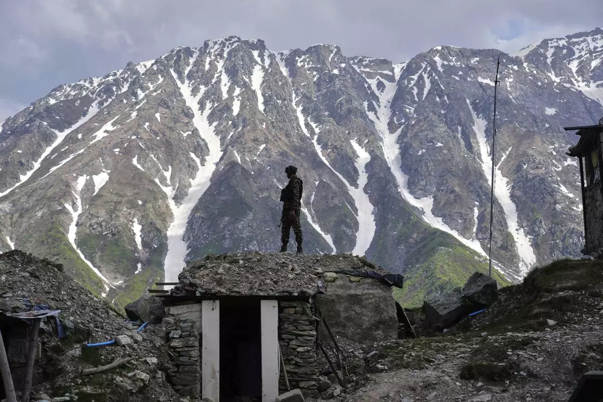 An Indian army soldier keeps a vigil from one of the forward posts along the line of control between India and Pakistan during a media tour somewhere in north of Indian-controlled Kashmir, Monday, May 19, 2025. (AP Photo/Mukhtar Khan)