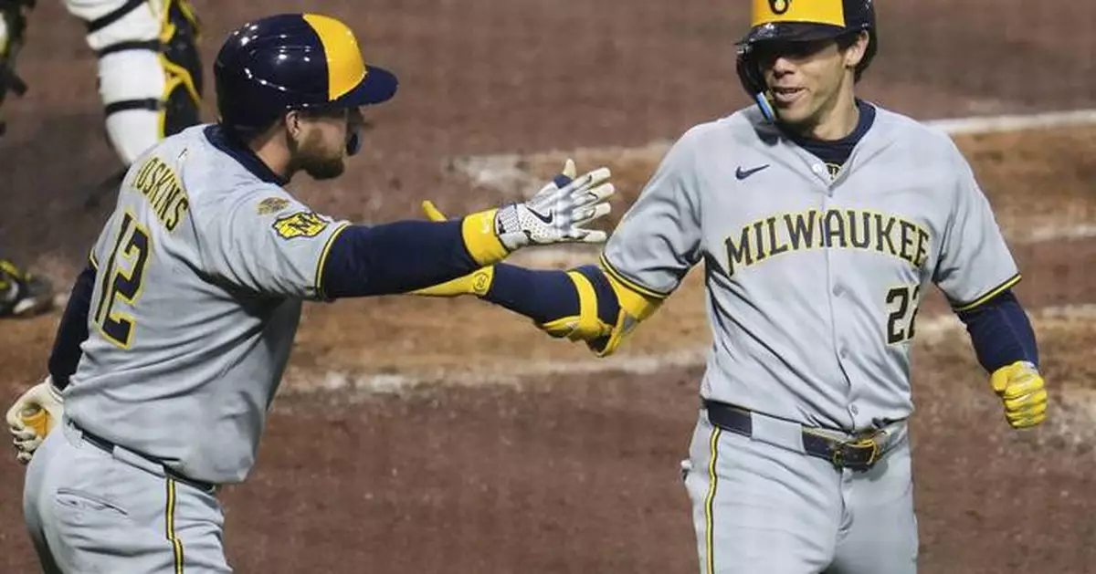 Yelich homers twice and the Brewers hold off the Pirates 8-5 after a long rain delay