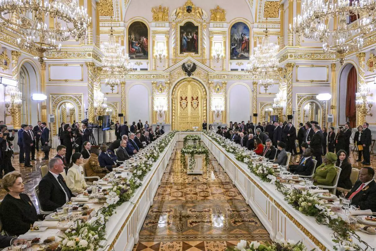 CORRECTS PHOTOGRAPHER Guests sit during a dinner on behalf of the President of the Russian Federation for heads of foreign delegations in the Grand Palace at the Kremlin in Moscow, Thursday, May 8, 2025, ahead of celebrations of the 80th anniversary of the Soviet Union's victory over Nazi Germany during the World War II. (Sergei Bobylev/Photo host agency RIA Novosti via AP)