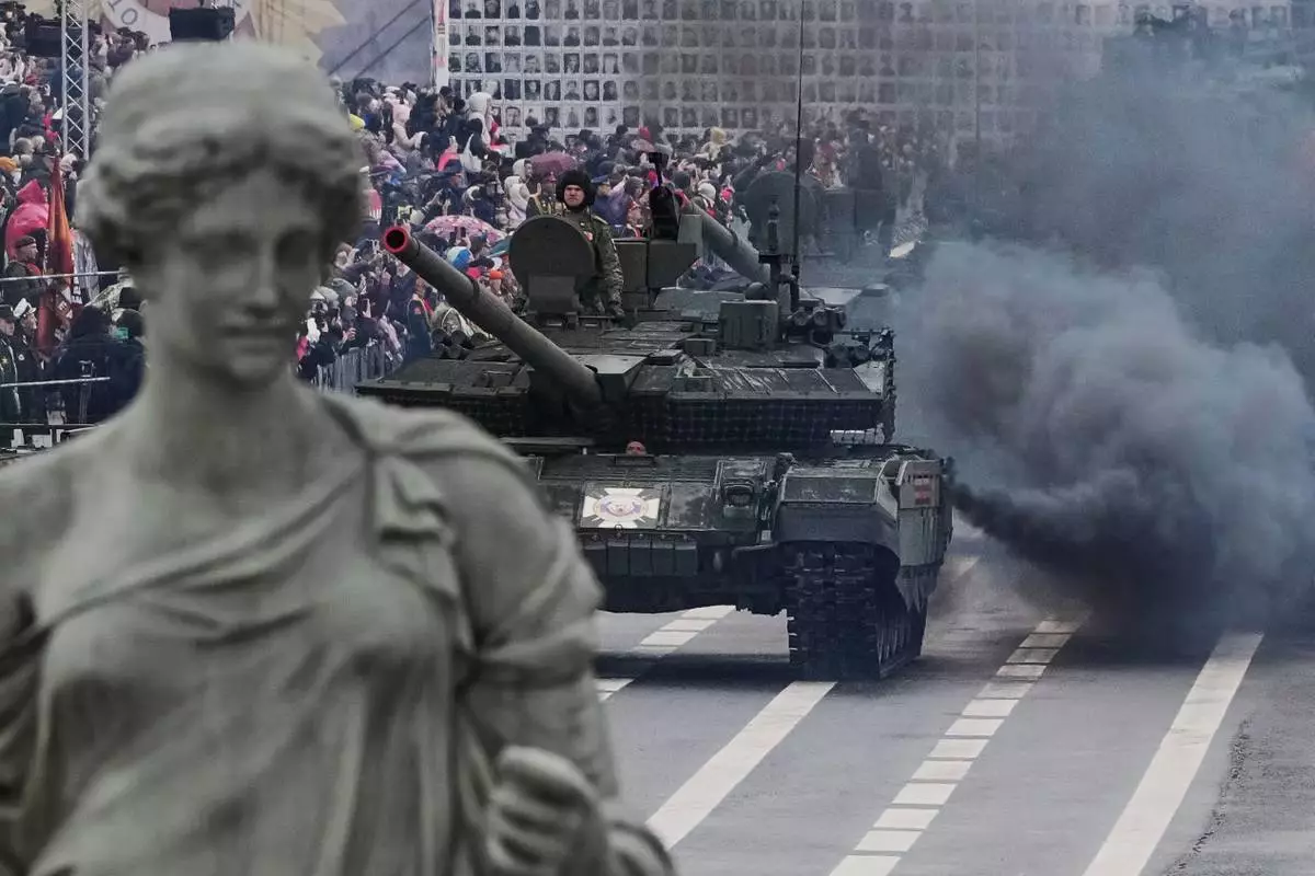 Russian tanks roll during a dress rehearsal for the Victory Day military parade at the Dvortsovaya (Palace) Square in St. Petersburg, Russia, Wednesday, May 7, 2025. (AP Photo/Dmitri Lovetsky)