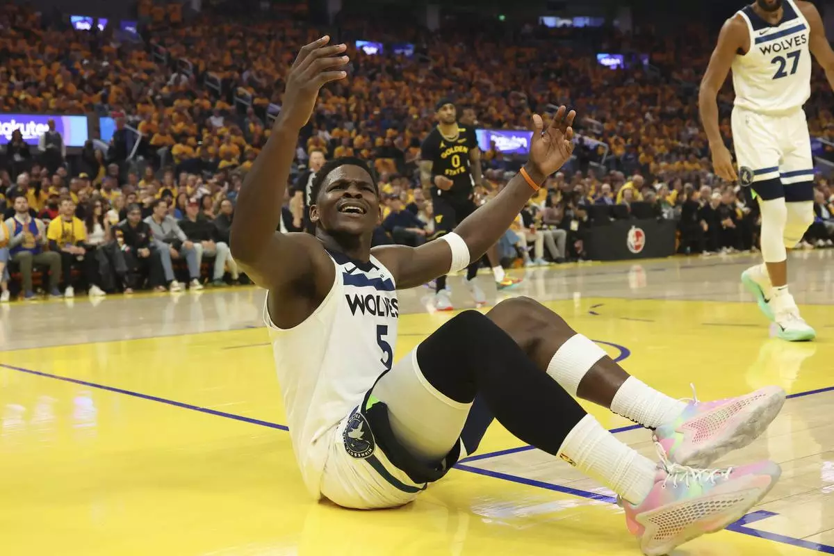 Minnesota Timberwolves guard Anthony Edwards (5) gestures to the referee during the first half of Game 4 in the Western Conference semifinals of the NBA basketball playoffs against the Golden State Warriors, Monday, May 12, 2025, in San Francisco. (AP Photo/Jed Jacobsohn)