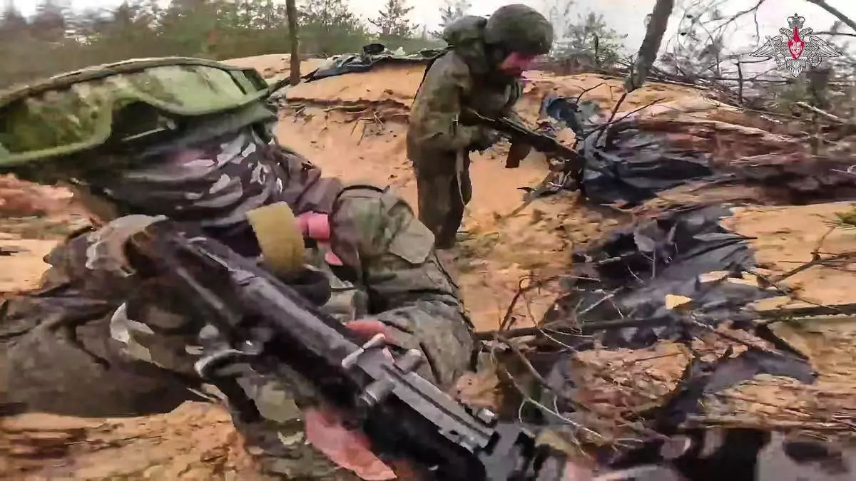 In this photo taken from video distributed by Russian Defense Ministry Press Service on Wednesday, May 21, 2025, Russian servicemen attend a combat training for assault units in an undisclosed location in Ukraine. (Russian Defense Ministry Press Service via AP)