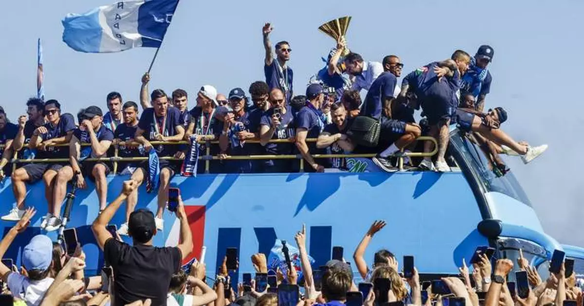Napoli celebrates Serie A title with seafront bus parade
