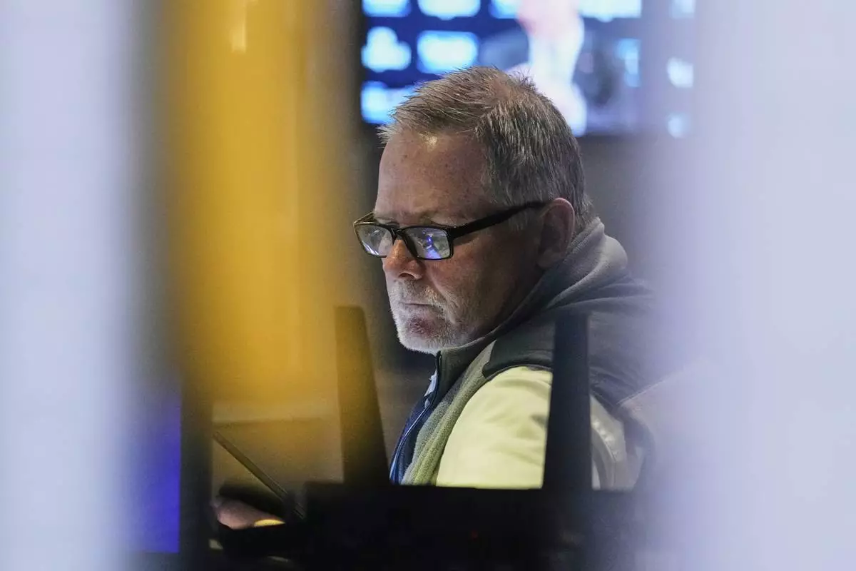 Trader Michael Conlon works on the floor of the New York Stock Exchange, Tuesday, May 20, 2025. (AP Photo/Richard Drew)