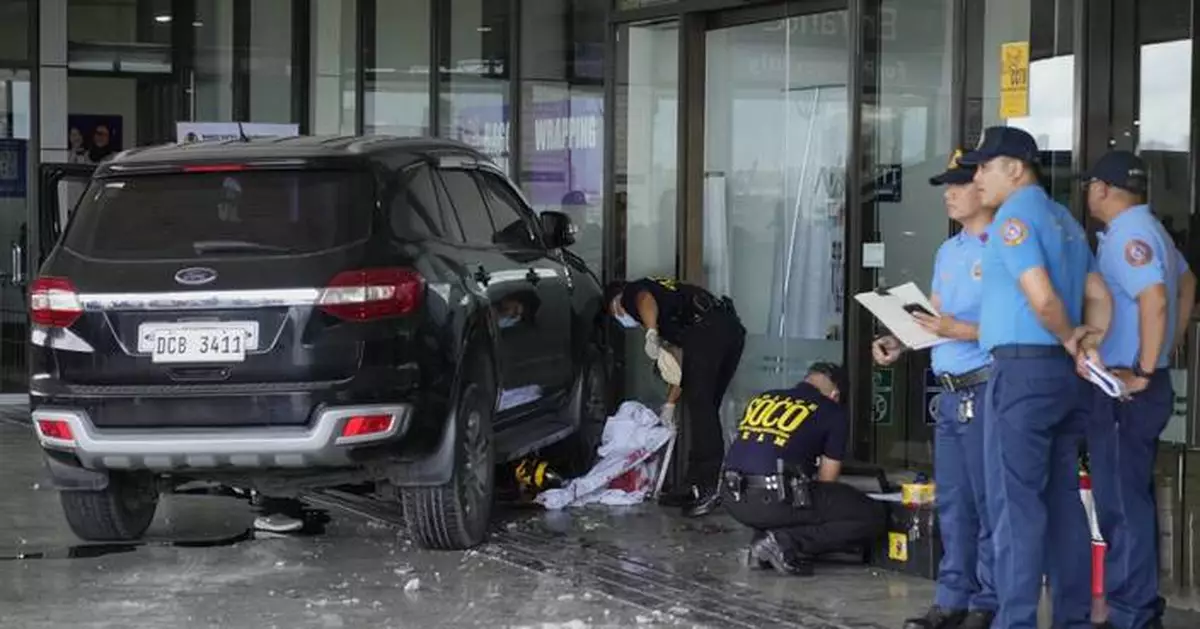 Vehicle crashes into entrance at Manila airport, killing 2 people including a young girl