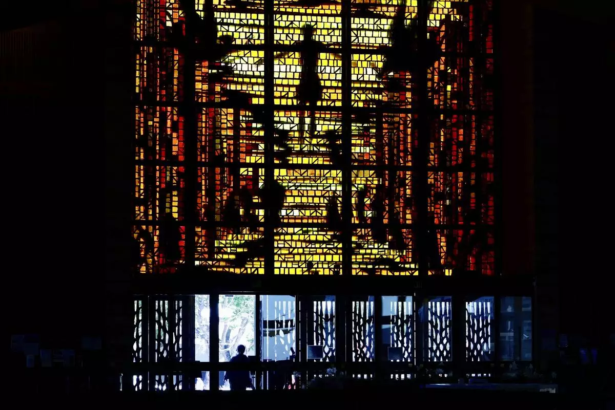 Worshippers enter the Cathedral of Saint Mary of the Assumption in San Francisco, Thursday, May 8, 2025, after newly elected Pope Leo XIV was announced. (Jessica Christian/San Francisco Chronicle via AP)