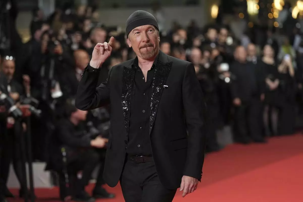 The Edge poses for photographers upon arrival at the premiere of the film 'Bono: Stories of Surrender' at the 78th international film festival, Cannes, southern France, Friday, May 16, 2025. (AP Photo/Natacha Pisarenko)