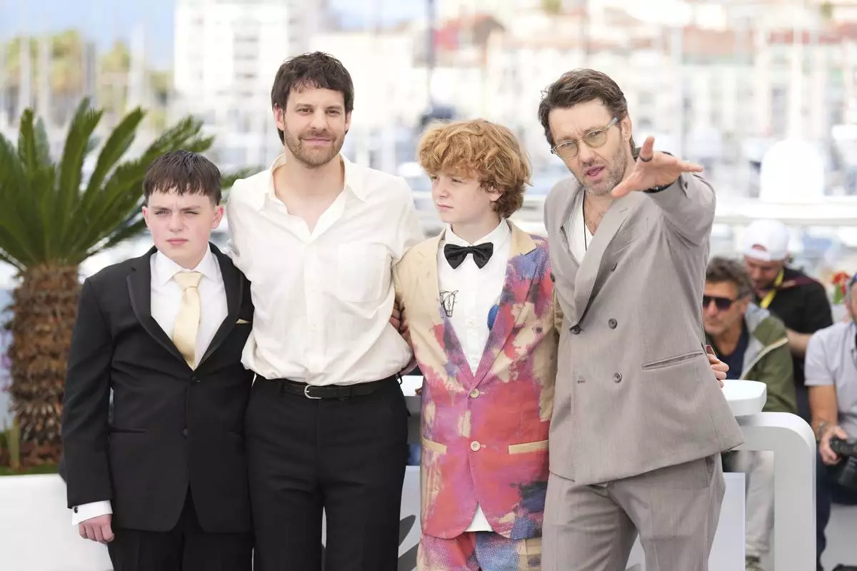 Kenny Rasmussen, from left, director Charlie Polinger, Kayo Martin and Joel Edgerton pose for photographers at the photo call for the film 'The Plague' at the 78th international film festival, Cannes, southern France, Friday, May 16, 2025. (AP Photo/Natacha Pisarenko)