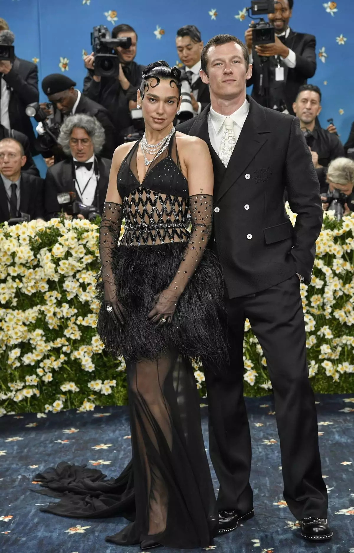 Dua Lipa, left, and Callum Turner attend The Metropolitan Museum of Art's Costume Institute benefit gala celebrating the opening of the "Superfine: Tailoring Black Style" exhibition on Monday, May 5, 2025, in New York. (Photo by Evan Agostini/Invision/AP)