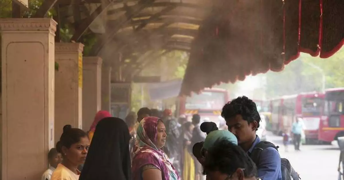 In one Indian city, reflective paint and bus stop sprinklers offer relief from killer heat