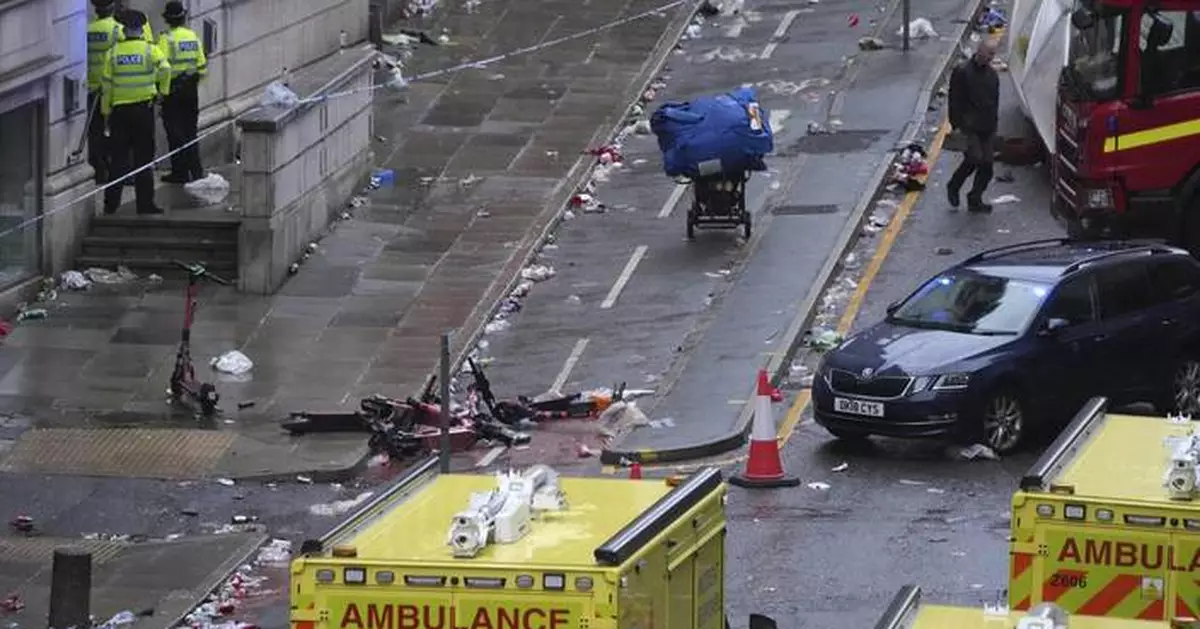 AP PHOTOS: Driver arrested after car plows into celebrating Liverpool fans