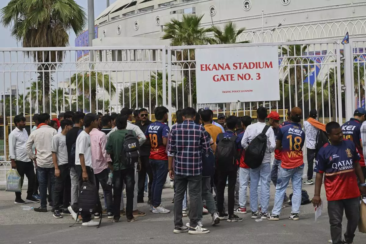 Fans gather outside Atal Bihari Vajpayee Ekana Cricket Stadium after organizers suspended the Indian Premier League for one week following the escalating military tensions with Pakistan, in Lucknow, India, Friday, May 9, 2025. (AP Photo)