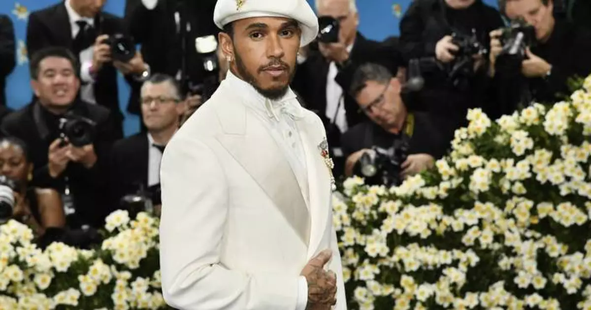 The Latest: The Met Gala opens as rain fails to dim the stars for fashion's biggest night