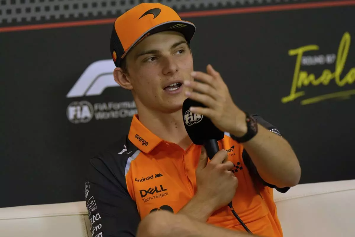 McLaren driver Oscar Piastri of Australia answers reporters during a news conference at the Enzo and Dino Ferrari racetrack, ahead the Italy's Emilia Romagna Formula One Grand Prix in Imola, Italy, Thursday, May 15, 2025. (AP Photo/Luca Bruno)