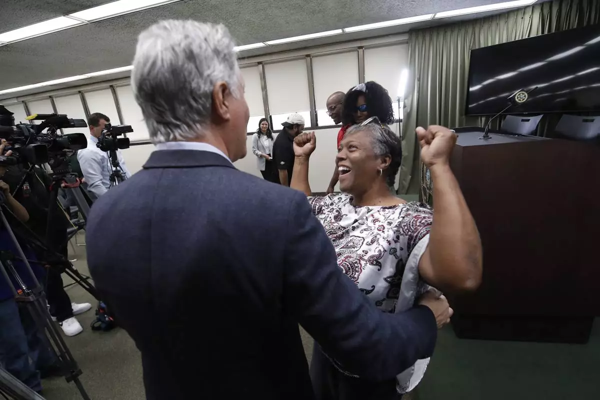 The mother of Tiffany Slaton, Fredrina, reacts to her daughter being found in the High Sierra after going missing for three weeks, during a press conference, Friday, May 16, 2025 in Fresno, Calif. (AP Photo/Gary Kazanjian)