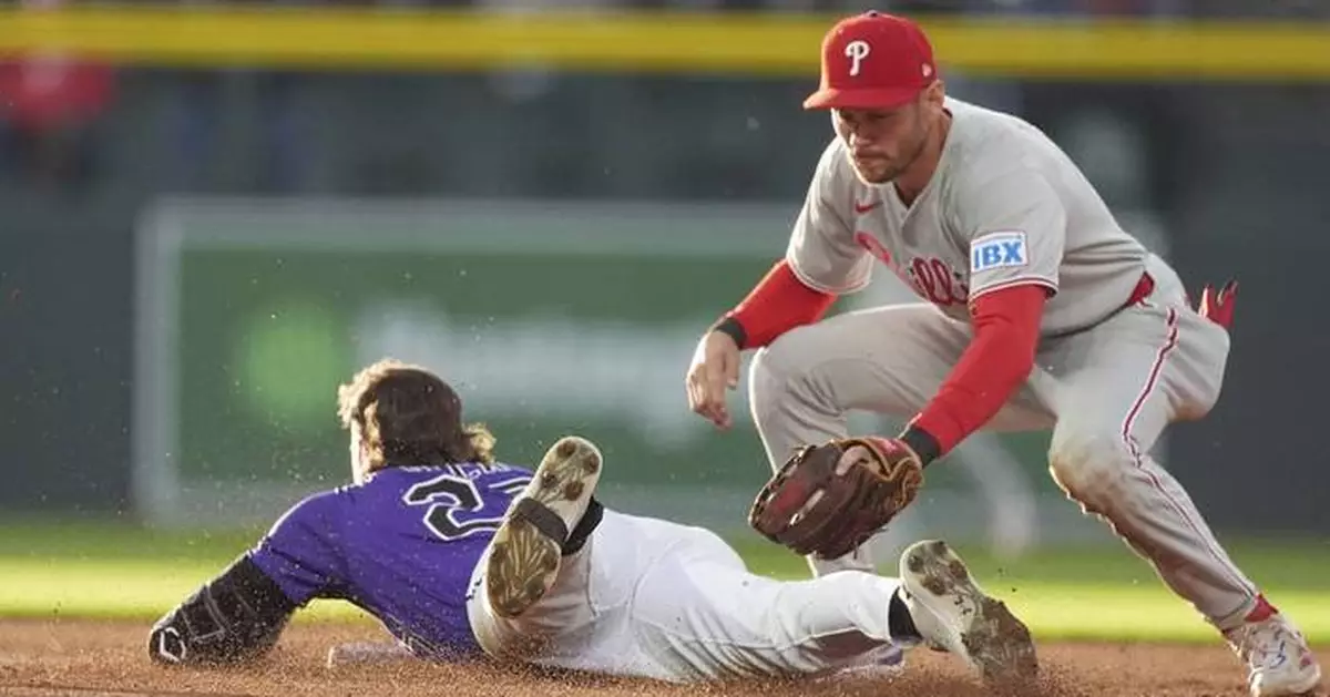 Schwarber hits 300th homer and Phillies rally past Rockies 9-3 to move into 1st place