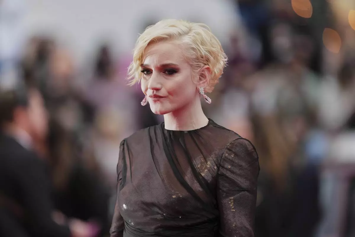 CORRECTED NAME SPELLING - Julia Garner poses for photographers during the opening ceremony red carpet of the 78th international film festival, Cannes, southern France, Tuesday, May 13, 2025. (Photo by Joel C Ryan/Invision/AP)