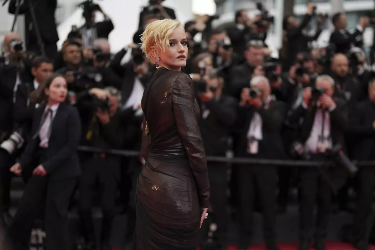 CORRECTED NAME SPELLING - Julia Garner poses for photographers during the opening ceremony red carpet of the 78th international film festival, Cannes, southern France, Tuesday, May 13, 2025. (Photo by Joel C Ryan/Invision/AP)