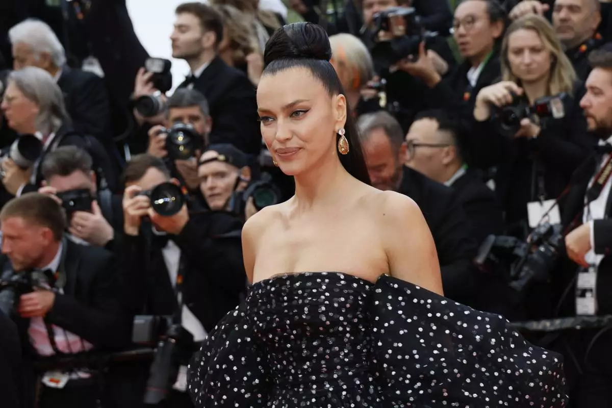 Irina Shayk poses for photographers during the opening ceremony red carpet of the 78th international film festival, Cannes, southern France, Tuesday, May 13, 2025. (Photo by Joel C Ryan/Invision/AP)