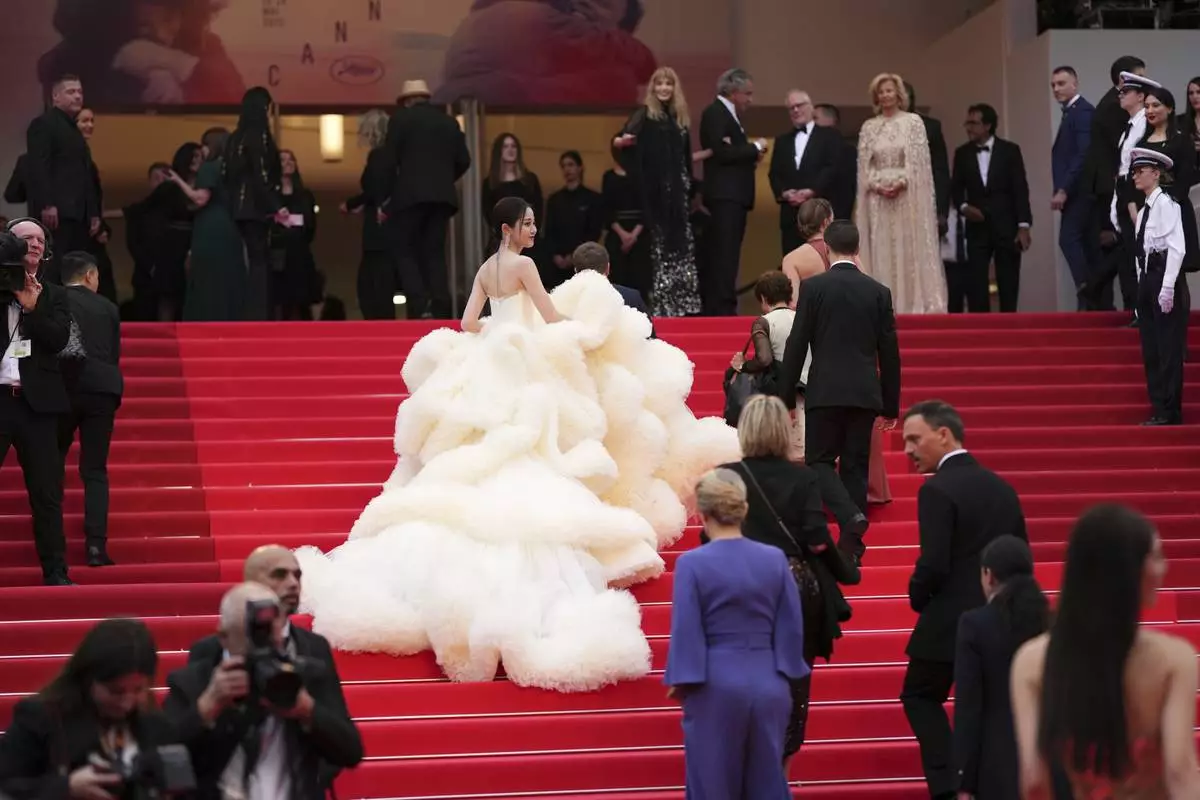 Wan QianHui poses for photographers during the opening ceremony red carpet of the 78th international film festival, Cannes, southern France, Tuesday, May 13, 2025. (Photo by Scott A Garfitt/Invision/AP)