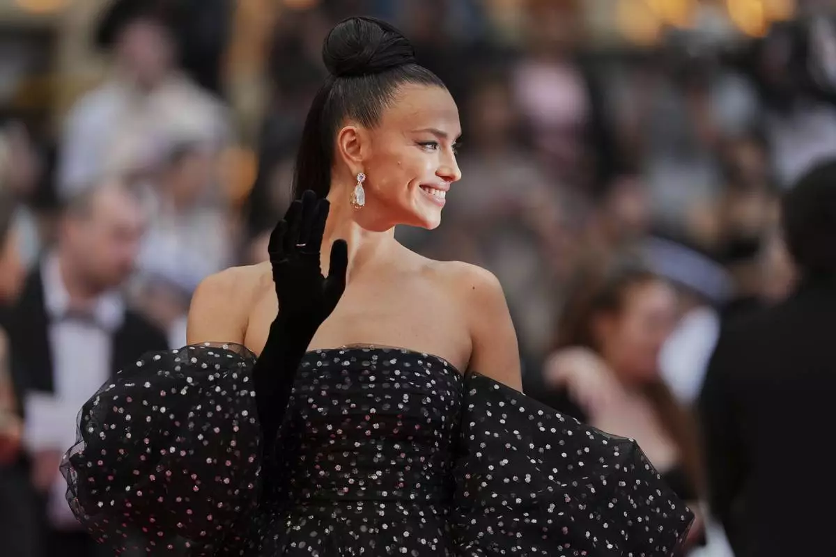 Irina Shayk poses for photographers during the opening ceremony red carpet of the 78th international film festival, Cannes, southern France, Tuesday, May 13, 2025. (Photo by Scott A Garfitt/Invision/AP)