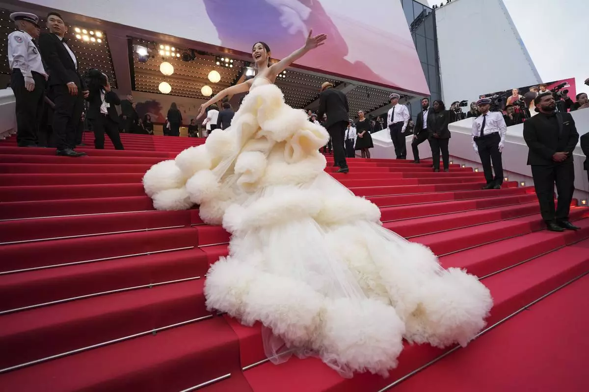 Wan QianHui poses for photographers during the opening ceremony red carpet of the 78th international film festival, Cannes, southern France, Tuesday, May 13, 2025. (AP Photo/Natacha Pisarenko)