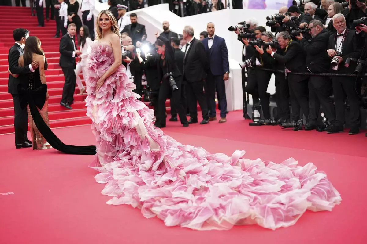 Heidi Klum poses for photographers during the opening ceremony red carpet of the 78th international film festival, Cannes, southern France, Tuesday, May 13, 2025. (Photo by Scott A Garfitt/Invision/AP)