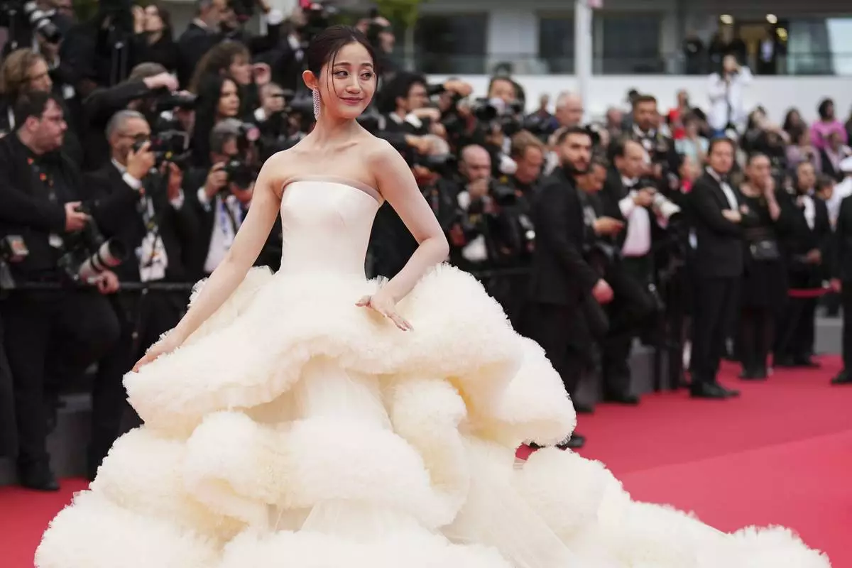 Wan QianHui poses for photographers during the opening ceremony red carpet of the 78th international film festival, Cannes, southern France, Tuesday, May 13, 2025. (Photo by Scott A Garfitt/Invision/AP)