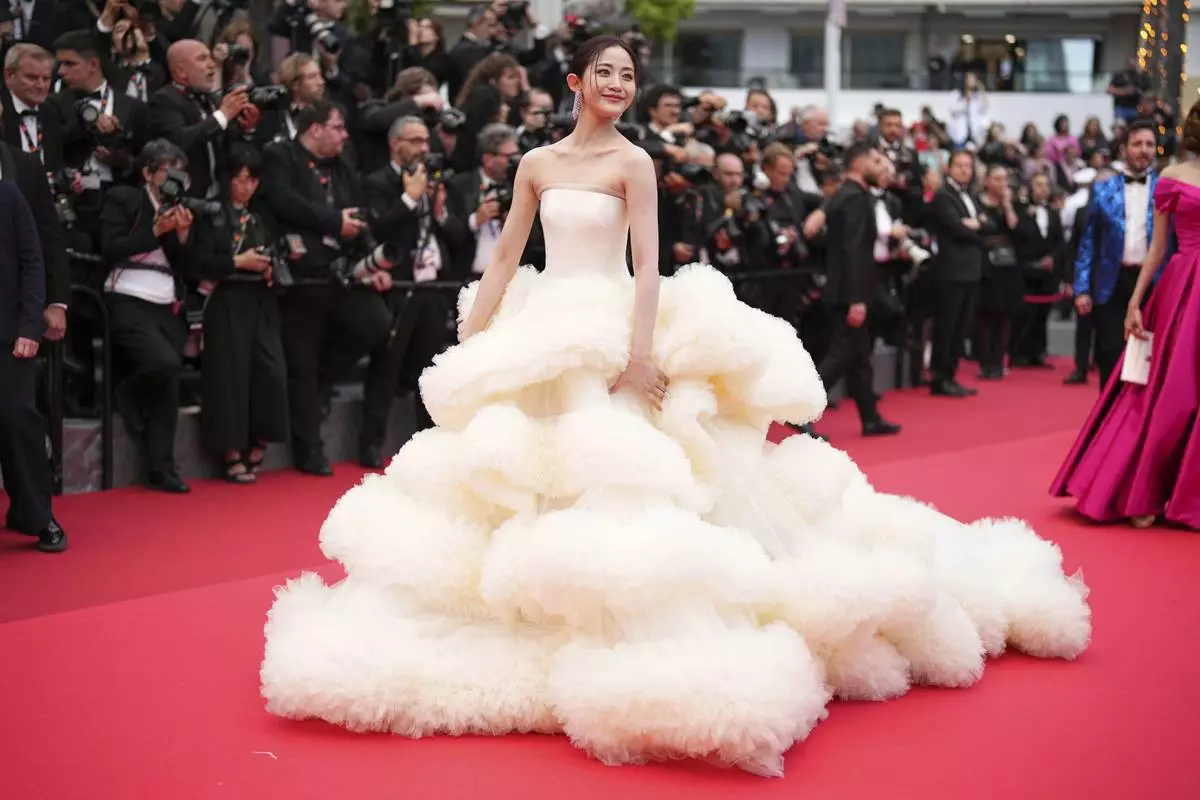 Wan QianHui poses for photographers during the opening ceremony red carpet of the 78th international film festival, Cannes, southern France, Tuesday, May 13, 2025. (Photo by Scott A Garfitt/Invision/AP)