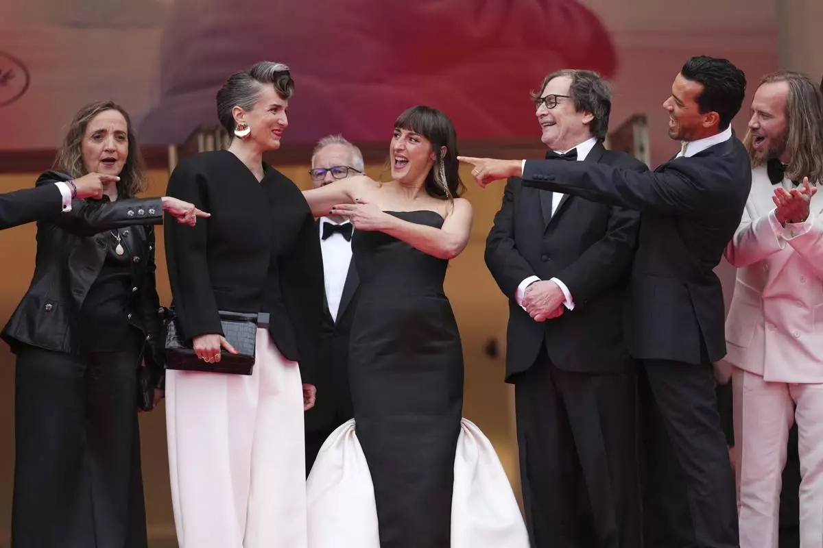 Dominique Blanc, from left, director Amelie Bonnin, Juliette Armanet, Francois Rollin, Tewfik Jallab, and co-writer Dimitri Lucas pose for photographers during the opening ceremony red carpet of the 78th international film festival, Cannes, southern France, Tuesday, May 13, 2025. (Photo by Scott A Garfitt/Invision/AP)