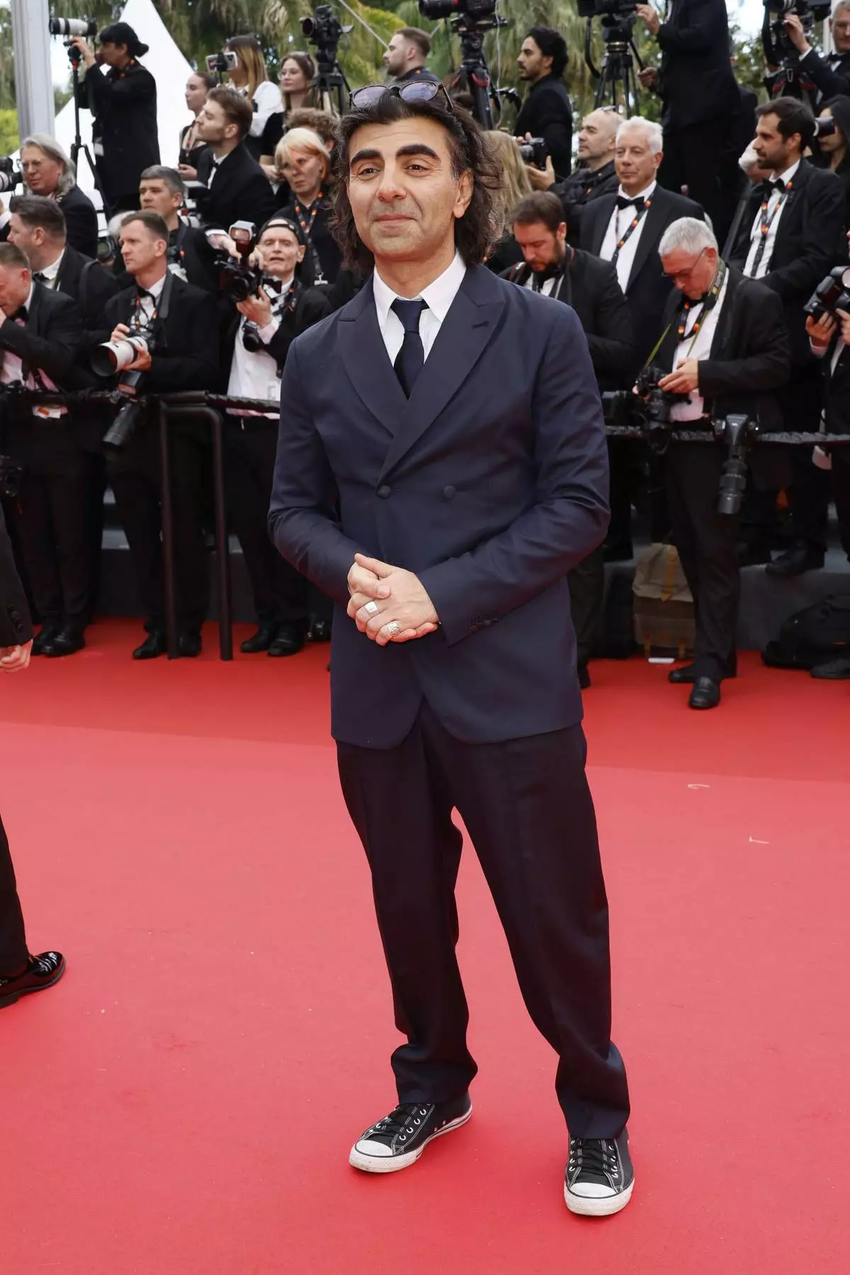 Fatih Akin poses for photographers during the opening ceremony red carpet of the 78th international film festival, Cannes, southern France, Tuesday, May 13, 2025. (Photo by Joel C Ryan/Invision/AP)