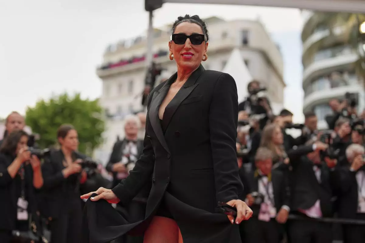 Rossy de Palma poses for photographers during the opening ceremony red carpet of the 78th international film festival, Cannes, southern France, Tuesday, May 13, 2025. (AP Photo/Natacha Pisarenko)